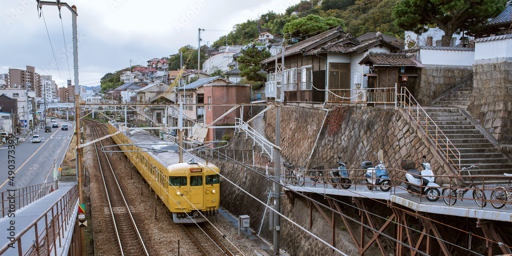 Train passing through Onomichi City, Hiroshima, Japan　広島県・尾道市の街並みと通過する電車