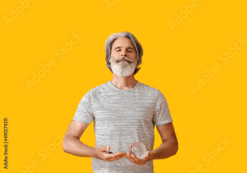 Mature man with gemstone an...