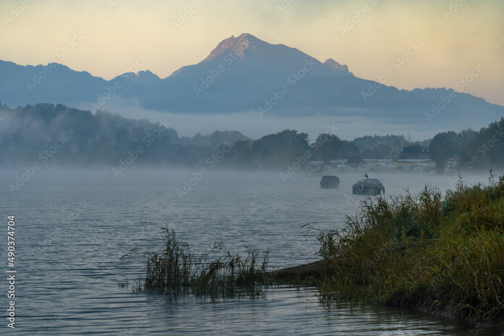 Shore of a lake in the early morning of autumn