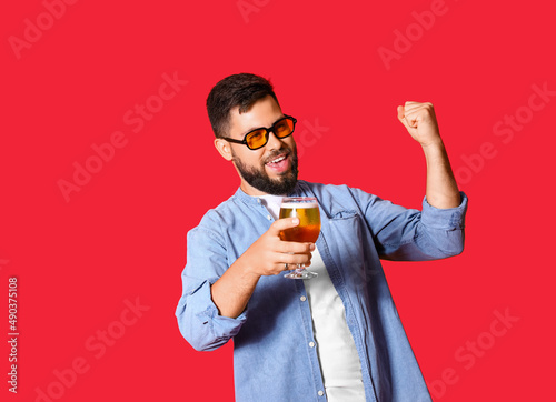 Happy young man in sunglass...