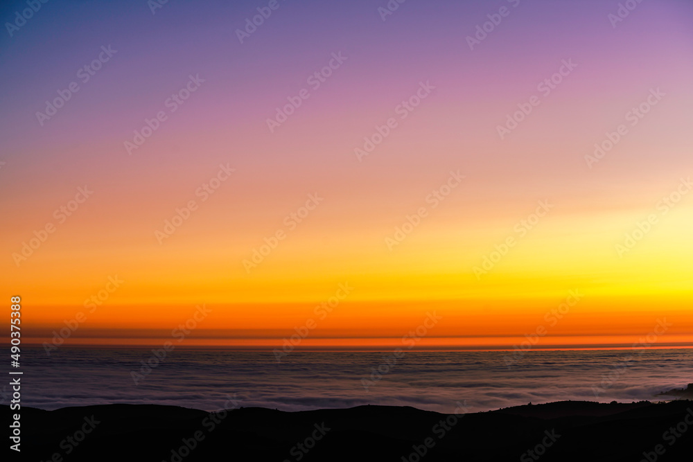 Fototapeta premium sunset over the clouds