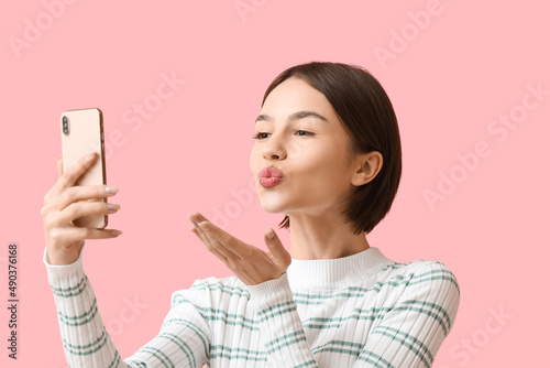 Beautiful woman taking self...
