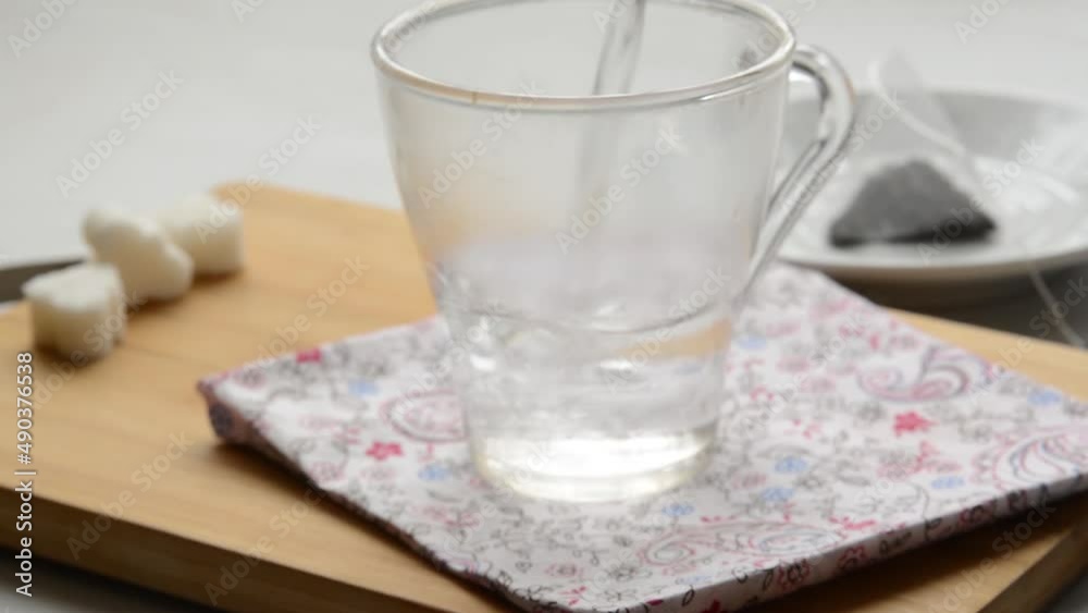 pouring hot water in a transparent cup. Tea making, Close up pouring hot water in a transparent cup. Tea making, Close up