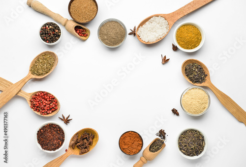 Frame made of aromatic spices on white background