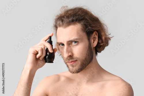 Young man with serum for sk...