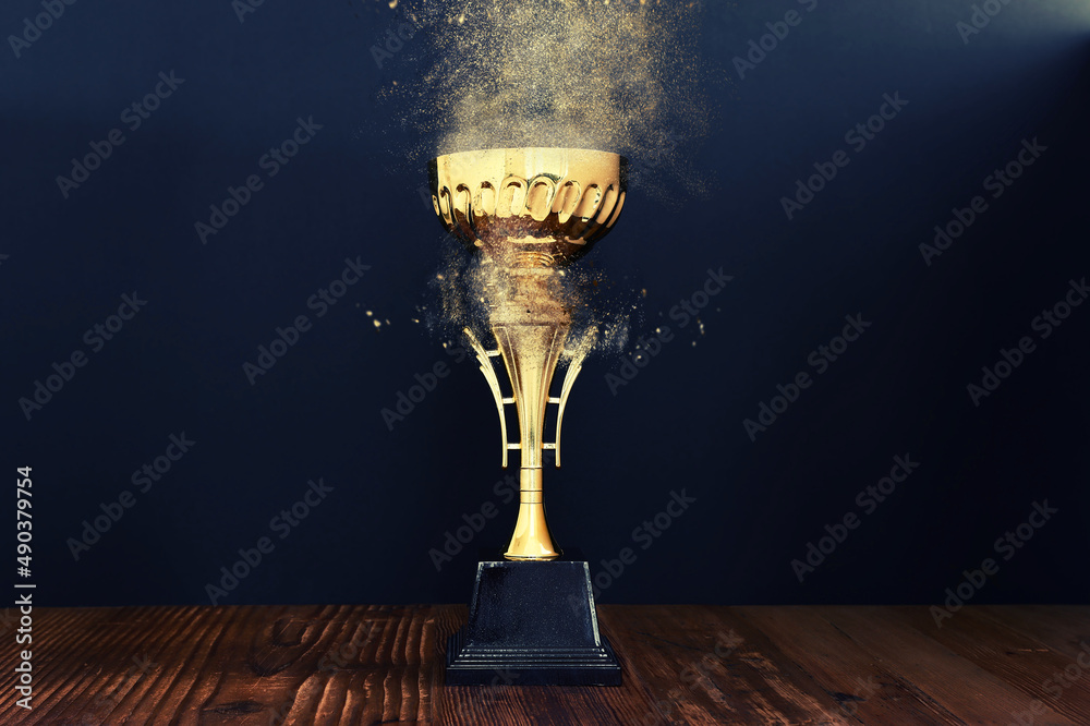 image of gold trophy over dark background Stock Photo | Adobe Stock