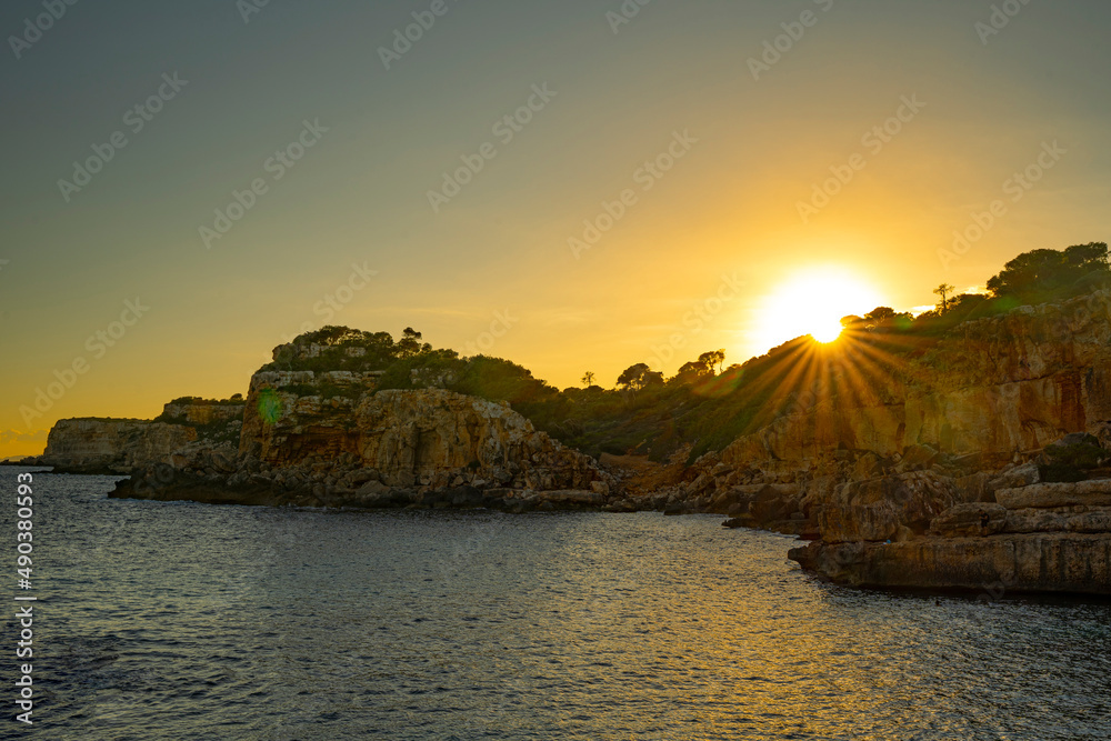 Sunset over the cliffs at Calos des Moros, Mallorca, Spain