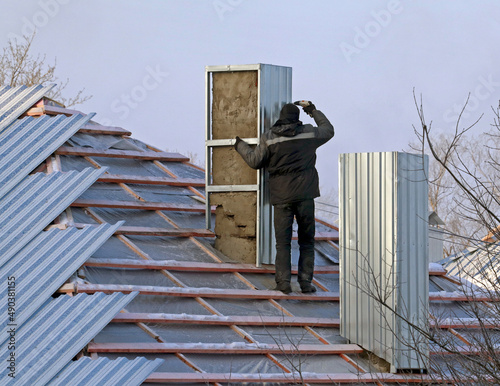 Repair pipe on the roof of an apartment building
