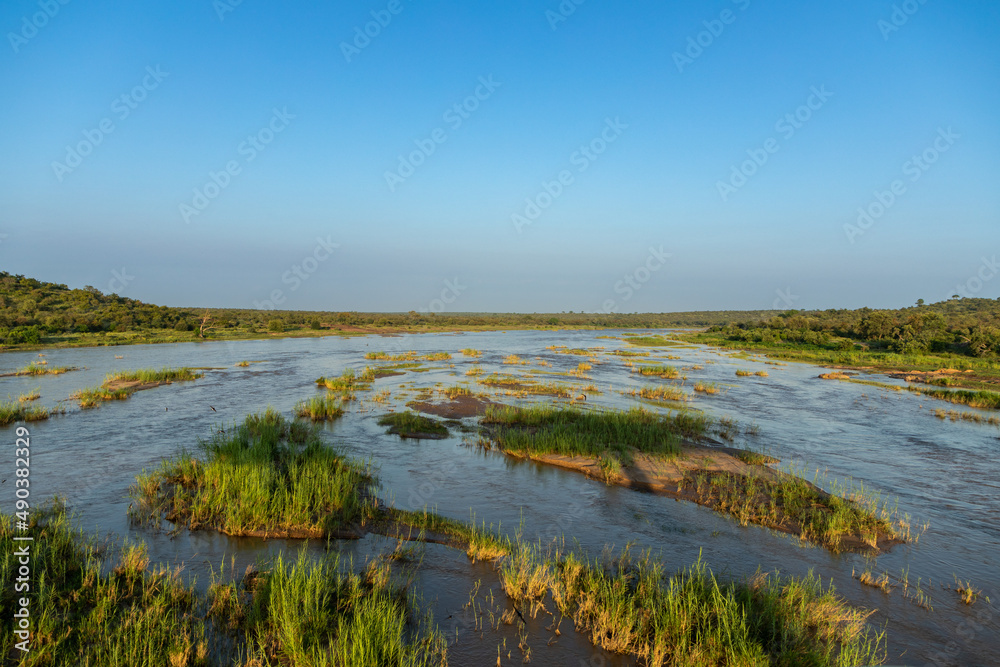 The large Olifants river in the morning sun.  The river is in the Kruger National park in South Africa 