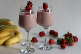 Strawberry banana milk shake. Shot on white background