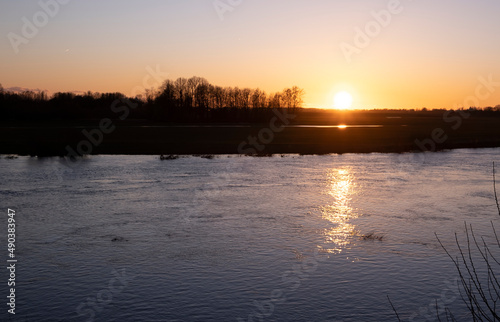 clear sky, golden sunset, river, spring evening near Lielupe river Latvia 
