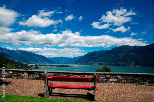 Bench with Panoramic View over Alpine Lake Maggiore with Mountain in Ronco sopra Ascona, Switzerland. photo