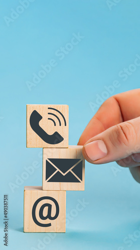 Website page contact us or e-mail marketing concept. Hand puttin
