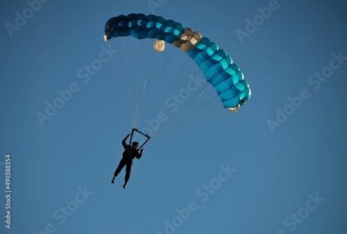 Parachute Flying Against Blue Sky in Locarno, Switzerland. photo