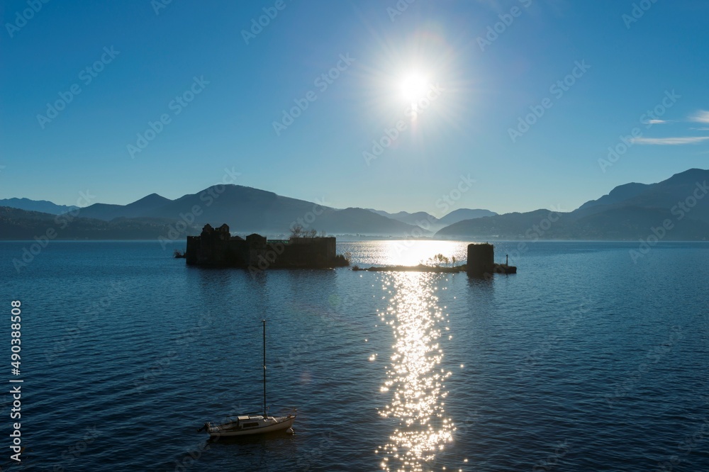 Castle Cannero on Alpine lake maggiore with Mountain and Sunlight in Piedmont, Italy. Castle Cannero on Alpine lake maggiore with Mountain and Sunlight in Piedmont, Italy.
