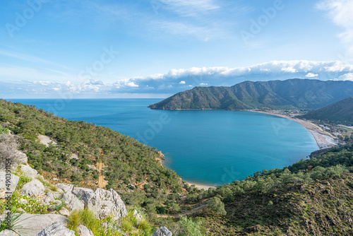 Fototapeta Naklejka Na Ścianę i Meble -  The Scenic view of  Bay of Adrasan from the Adrasan Castle, naturally protected area, surrounded by a national park with pine forests, Taurus Mountains, blue water lagoons and sandy beaches.