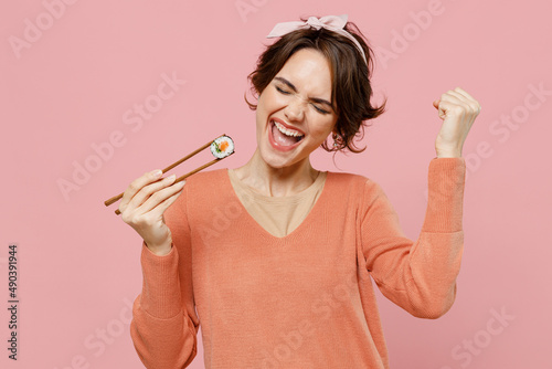 Fotografie Young overjoyed excited happy cool fun woman 20s in casual clothes hold in hand
