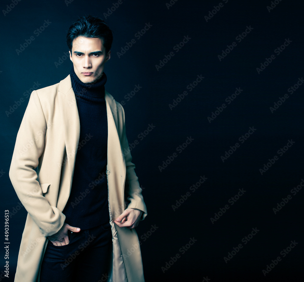 handsome asian fashion looking man posing in studio on black background, lifestyle modern people concept handsome asian fashion looking man posing in studio on black background, lifestyle modern people concept
