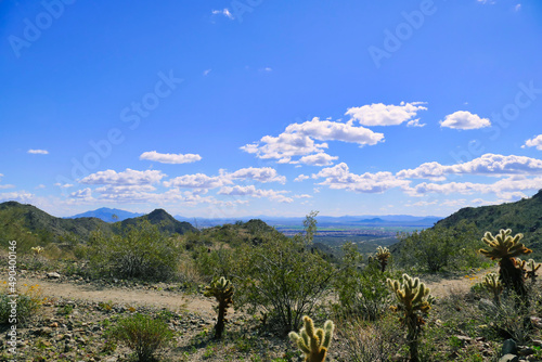 Walking trail in the desert of Skyline Regional Park in the southern White Tank Mountains , Buckeye, Arizona, USA, with a view of the plain of Phoenix
