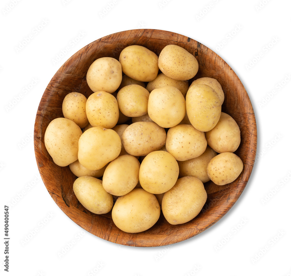Tiny potatoes in a bowl isolated over wooden table Tiny potatoes in a bowl isolated over wooden table