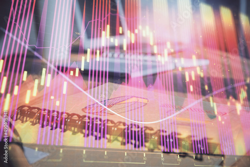 Double exposure of financial graph drawings and desk with open notebook background. Concept of forex market © peshkova