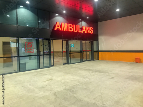 Kartal, Istanbul, Turkey - 07.24.2021: red ambulance sign on entrance gate exterior of Lutfi Kirdar Training and Research Hospital emergency department for healthcare curing illness concepts
