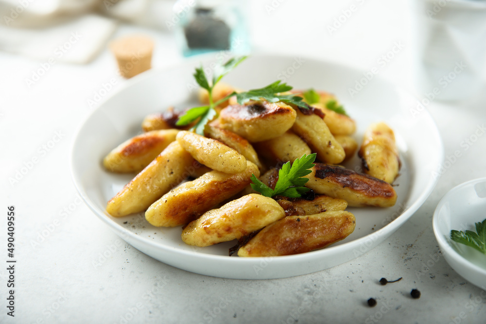 Traditional German potato dumplings with fried onion