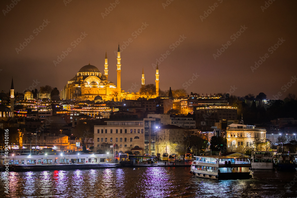 View to the Suleymaniye Mosque from the seaside. Ramadan or kandil or laylat al-qadr or islamic background . Suleymaniye mosque is built by Mimar Sinan during Ottoman Empire era.