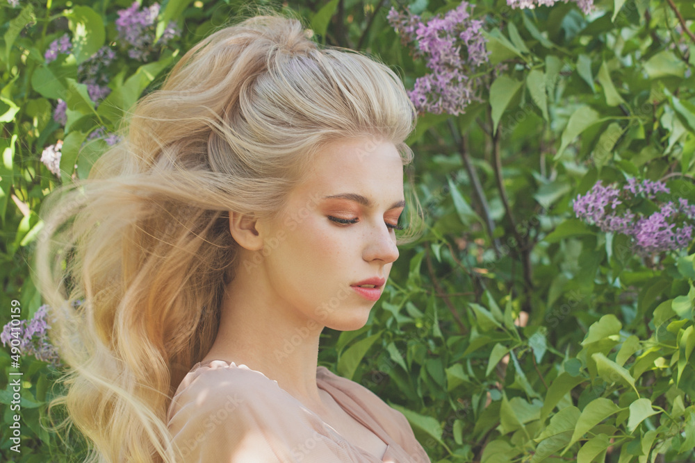 Beautiful young woman with long blonde hairdo. Pretty model outdoor Beautiful young woman with long blonde hairdo. Pretty model outdoor