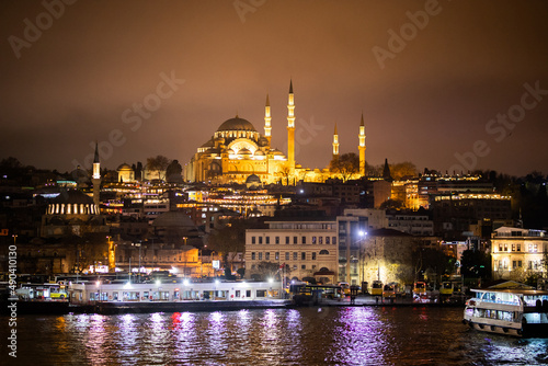 View to the Suleymaniye Mosque from the seaside. Ramadan or kandil or laylat al-qadr or islamic background . Suleymaniye mosque is built by Mimar Sinan during Ottoman Empire era.