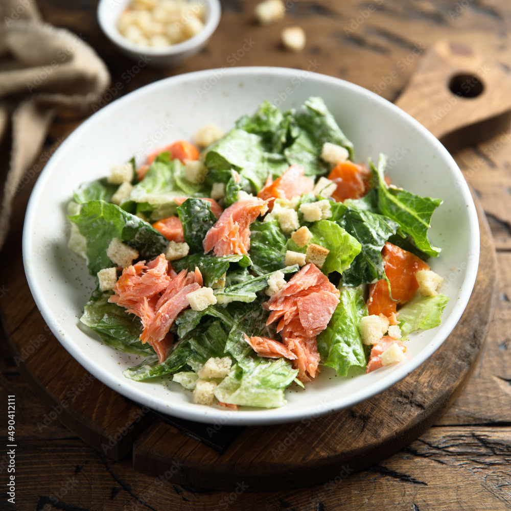 Traditional Caesar salad with salmon