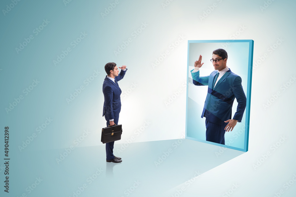 Young businessman in alter ego concept Young businessman in alter ego concept