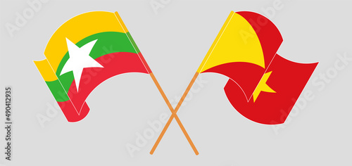 Crossed and waving flags of Myanmar and Tigray