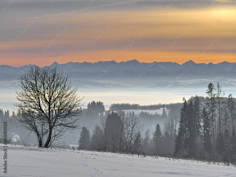 Tatra Mountains and a hazy valley Tatra Mountains and a hazy valley