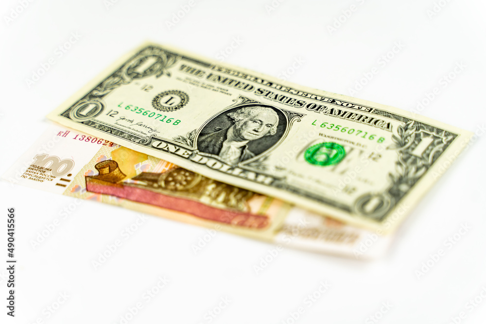 Russian and American paper money. Russian ruble and US dollar exchange rate. Russian and American paper money. Russian ruble and US dollar exchange rate.