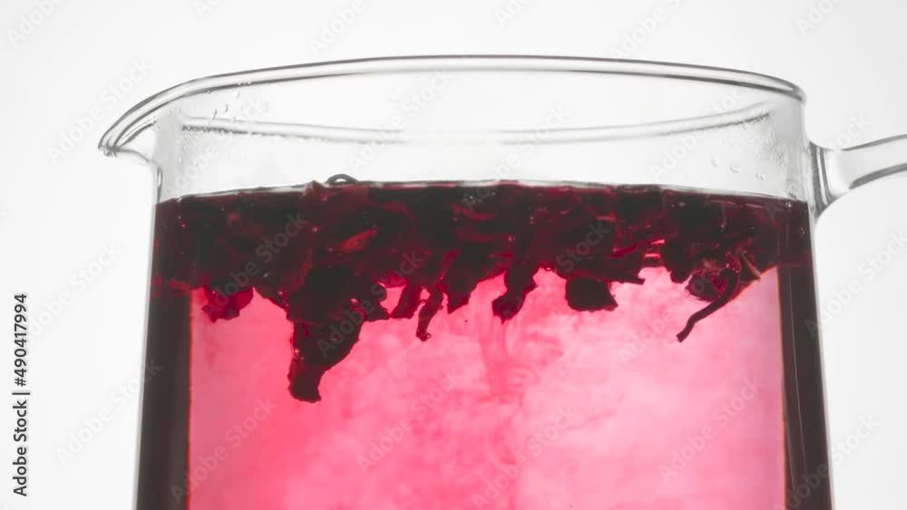 Hibiscus Brewed in Boiling Water. Time Lapse. Dried hibiscus petals