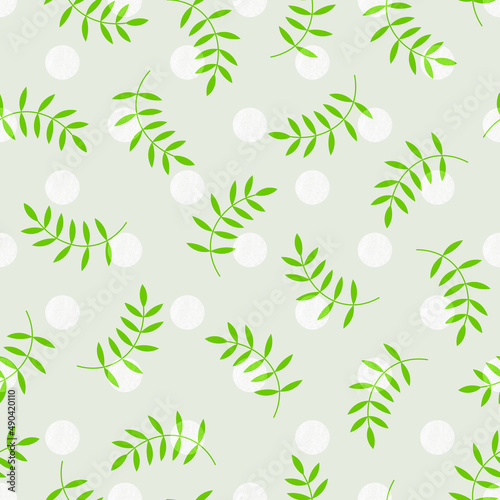 Seamless pattern with dots and green leaves