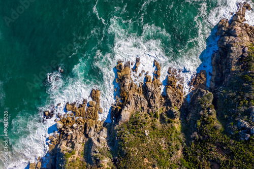 Aerial photo over Seychelles displaying the natural unspoilt beauty of the islands - from the crystal clear oceans to the lush green forests and granite boulders cascading on the white beaches. 