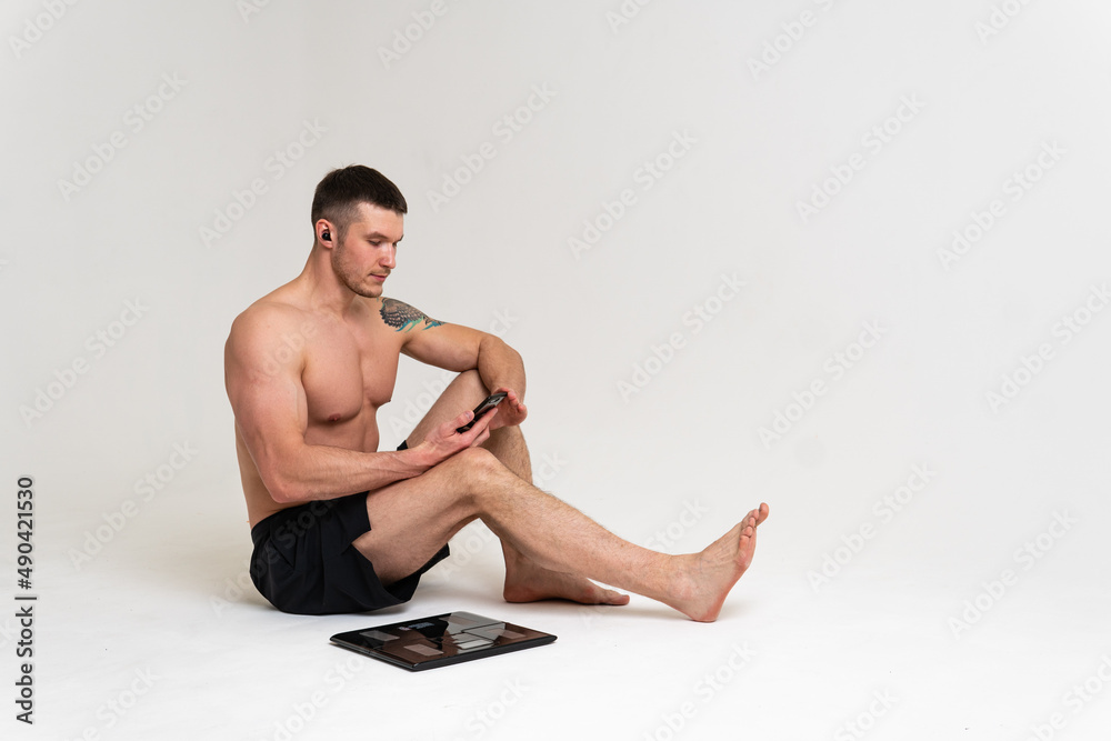Fototapeta premium Man with weights health pondered, health and sports on a white background pain body injury, ill male adult, illness Tension neck care, ain suffer attractive