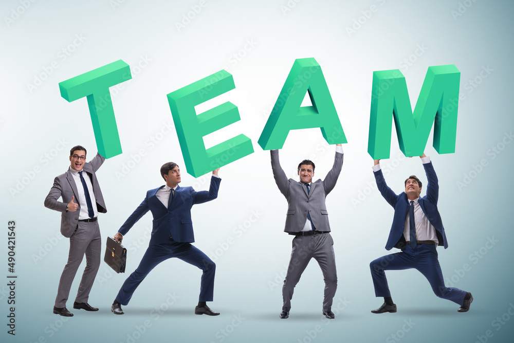 Teamwork concept with people carrying team letters Teamwork concept with people carrying team letters