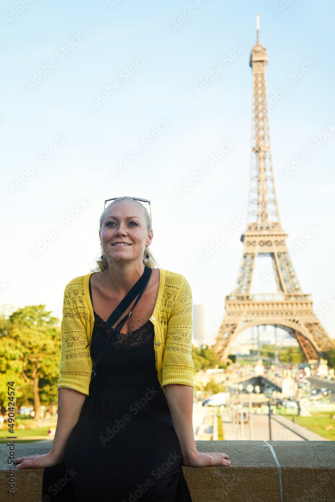 Making holiday memories. An attractive young woman sight seeing in the Paris.