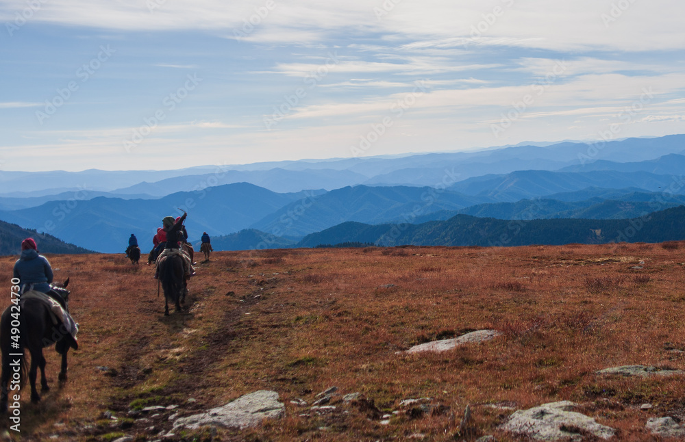 equestrian trip in the Altai mountains, descent from the mountain on horseback