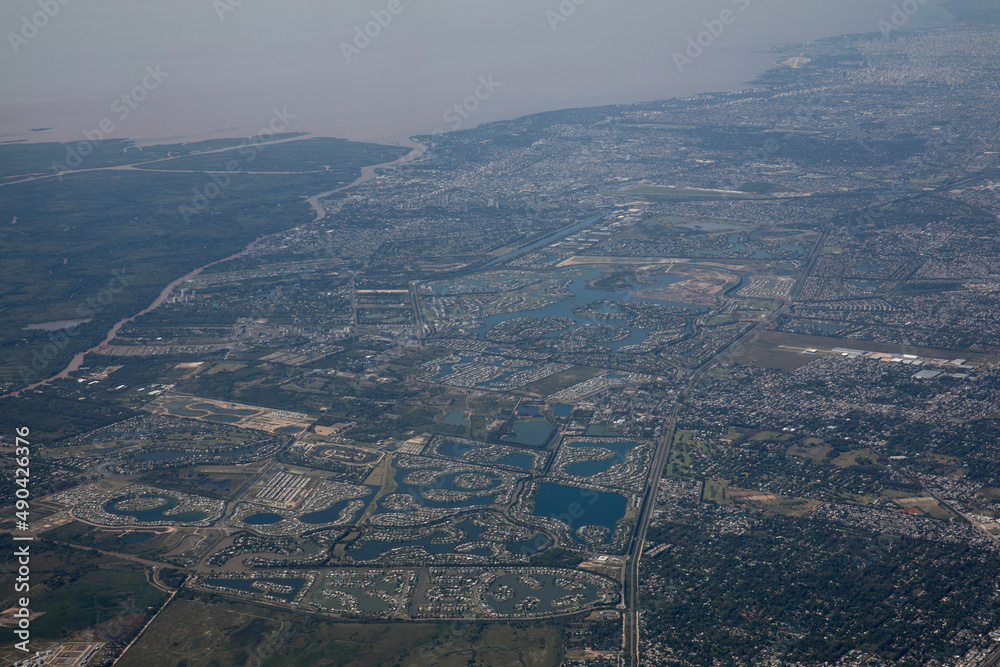 Obraz premium Cityscape. View of the city and river from a plane.