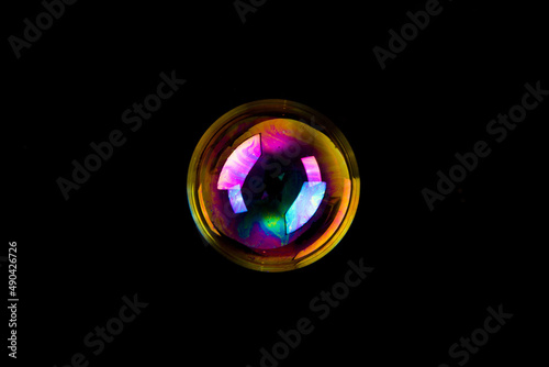 Soap bubble isolated on black background. Copy space.