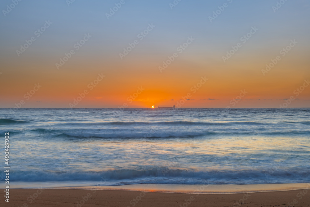 Sun, sand, ship sunrise seascape