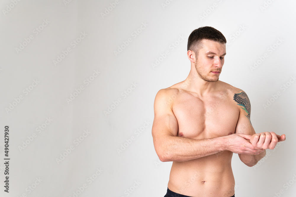 Measures Pulse on the hand of a white man in the background pain body injury, backache isolated health illness holding. Touching lumbar care, ain suffer attractive Measures Pulse on the hand of a white man in the background pain body injury, backache isolated health illness holding. Touching lumbar care, ain suffer attractive