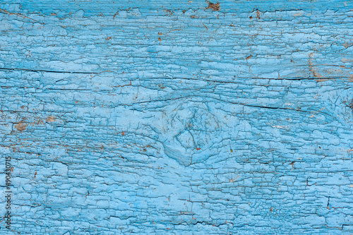 Cracked blue paint. Seamless background old texture.