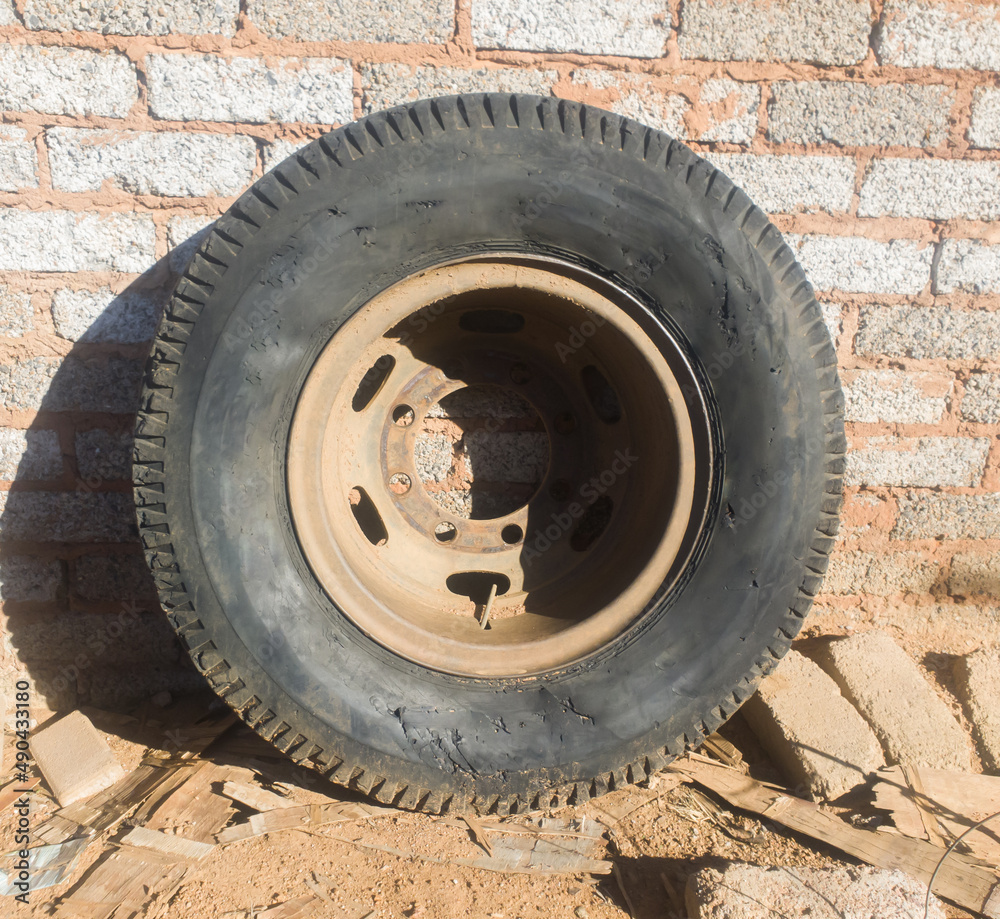 old and used up truck tire with no air