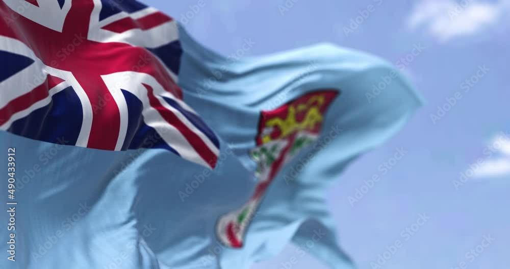 Detail of the national flag of FIji waving in the wind on a clear day