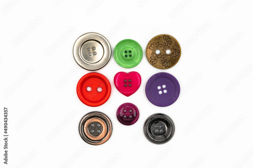 collection of various buttons on white background. each one is shot separately collection of various buttons on white background. each one is shot separately